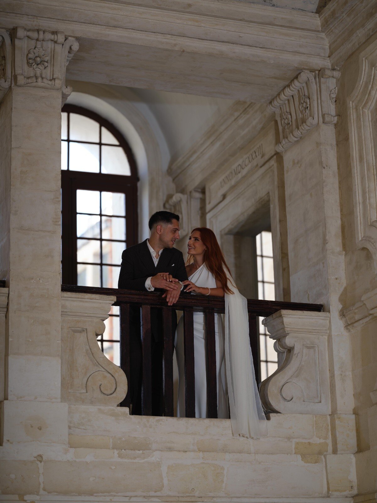 Mandy and Mauro together on a balcony